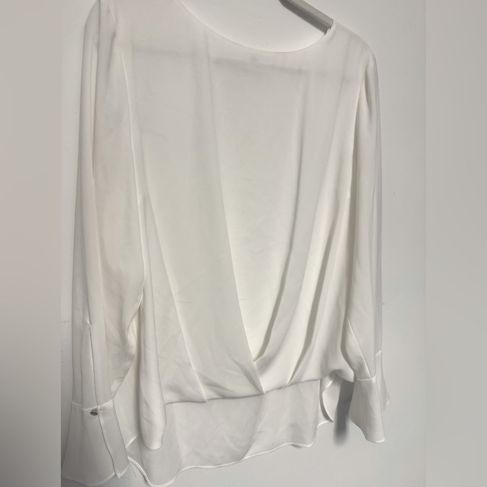 NWOT. Women’s silky blouse